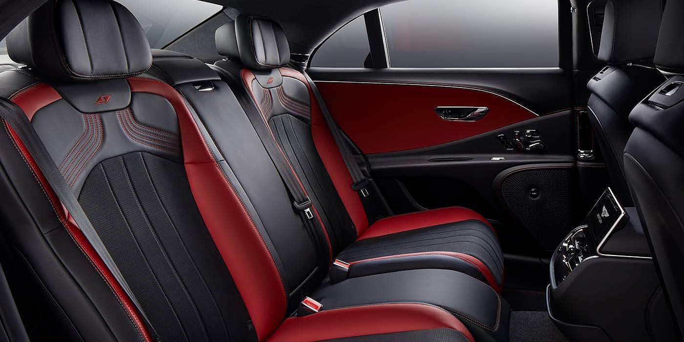 Bentley Emirates -  Dubai Bentley Flying Spur S sedan rear interior in Beluga black and Hotspur red hide with S stitching
