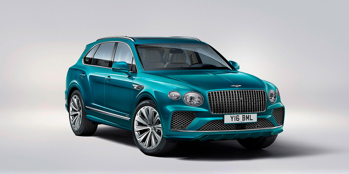 Bentley Emirates -  Dubai Bentley Bentayga Azure front three-quarter view, featuring a fluted chrome grille with a matrix lower grille and chrome accents in Topaz blue paint.