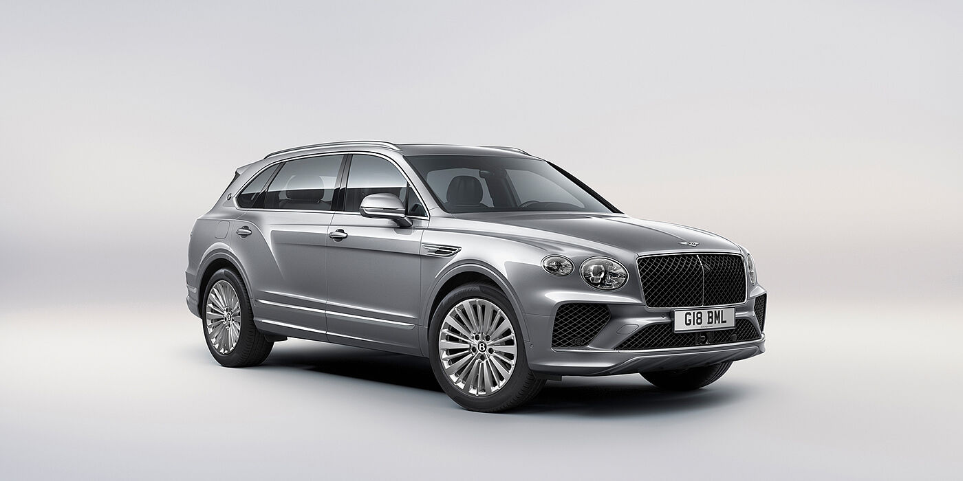 Bentley Dubai Bentley Bentayga Extended Wheelbase luxury SUV front three quarter view in Moonbeam paint with 21 inch five spoke painted wheels