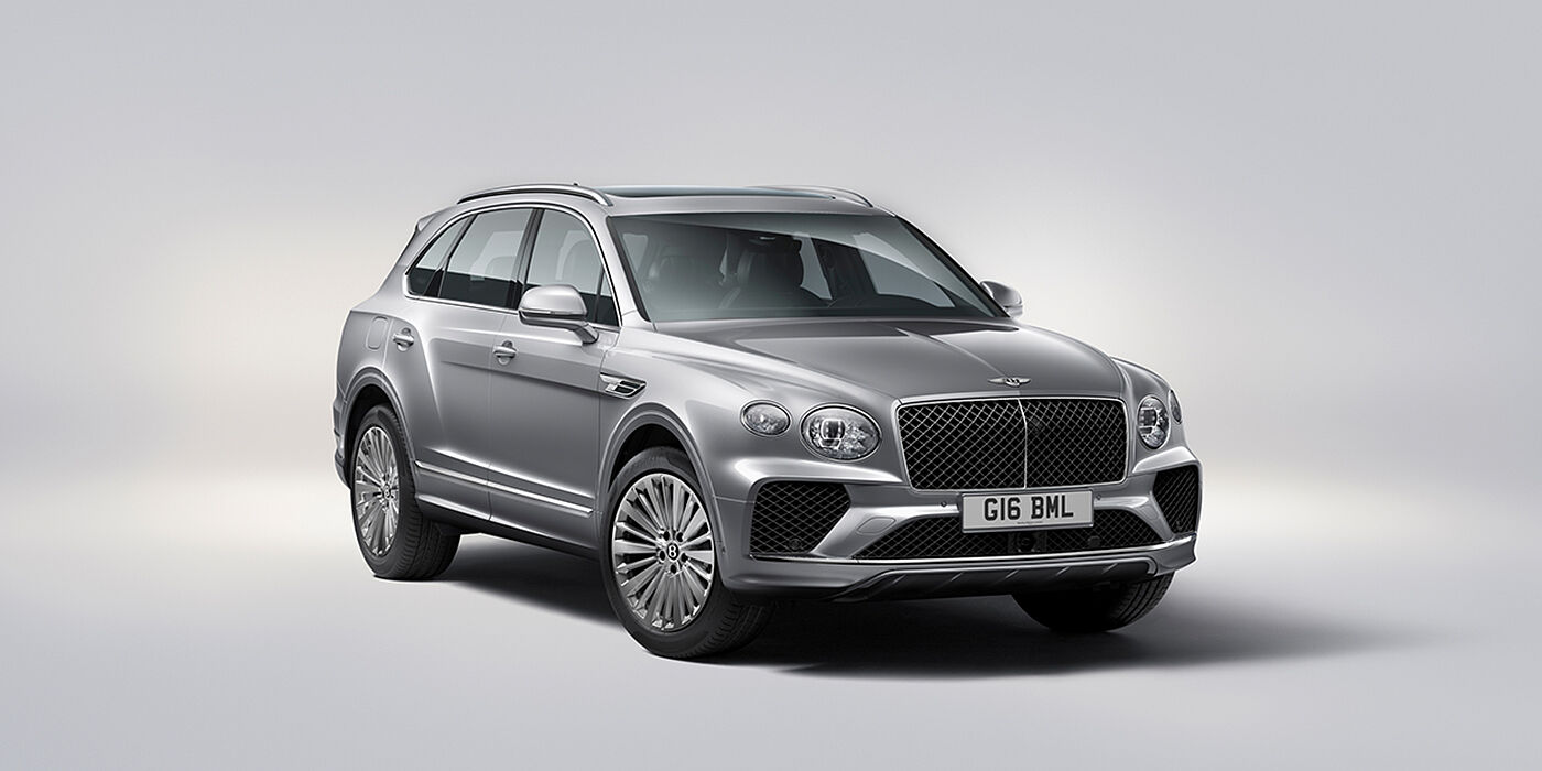 Bentley Dubai Bentley Bentayga luxury SUV front three quarter view in Moonbeam paint with matrix grille and 21″ 5 spoke painted wheels