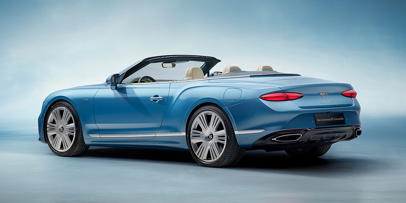 Bentley Dubai New Bentley Continental GTC Azure convertible rear view in Light Windsor blue paint with 22 inch ten spoke wheels and chrome exterior details