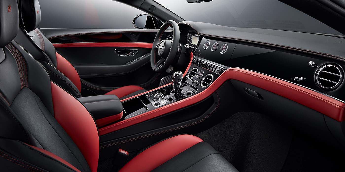 Bentley Emirates -  Dubai Bentley Continental GT S coupe front interior in Beluga black and Hotspur red hide with high gloss Carbon Fibre veneer