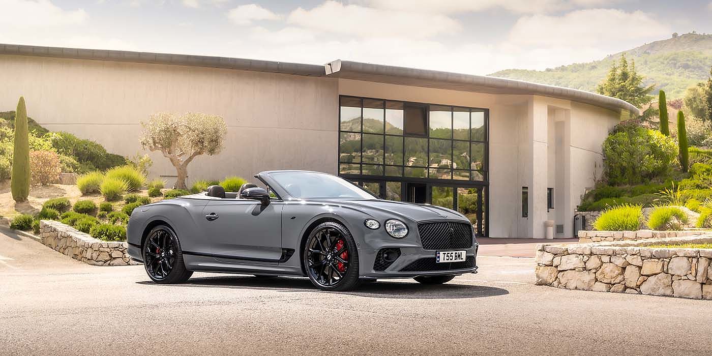 Bentley Emirates -  Dubai Bentley Continental GTC S convertible in Cambrian Grey paint front 34 static near house