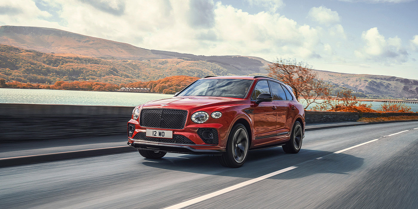 Bentley Emirates -  Dubai Bentley Bentayga S SUV in Candy Red paint front 34 dynamic