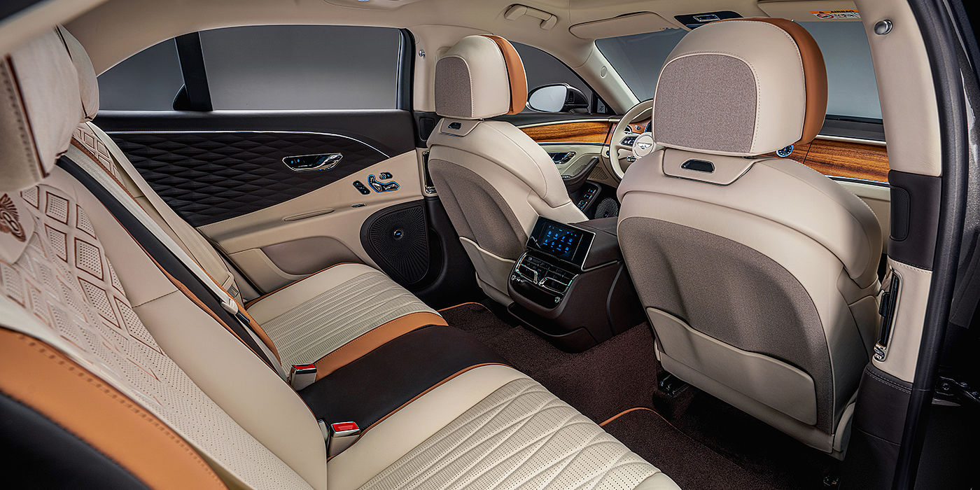 Bentley Emirates -  Dubai Bentley Flying Spur Odyssean sedan rear interior with Diamond in Linen and Burnt Oak hides