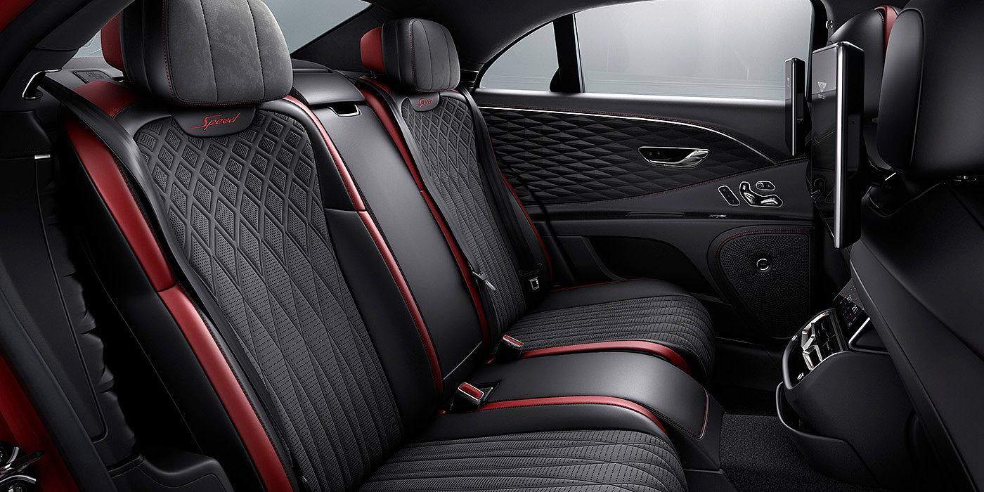 Bentley Emirates -  Dubai Bentley Flying Spur Speed sedan rear interior in Beluga black and Cricket Ball red hide