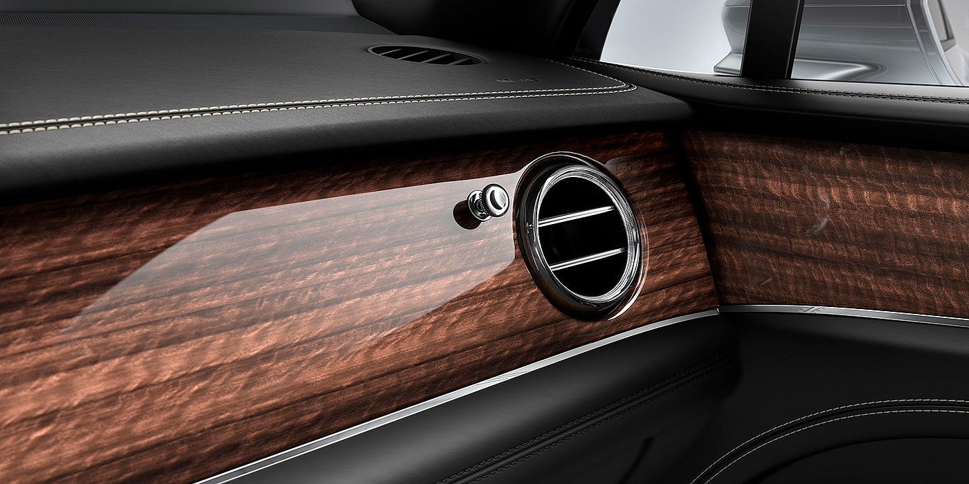 Bentley Emirates -  Dubai Bentley Bentayga front interior Crown Cut Walnut veneer and chrome air vent.
