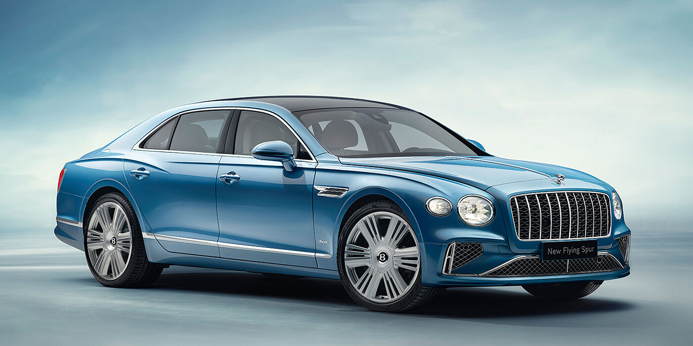 Bentley Dubai New Bentley Flying Spur Azure sedan front view in Light windsor blue by Mulliner paint with 22 inch Azure wheels and chrome exterior details