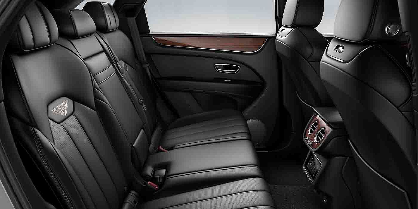 Bentley Emirates -  Dubai Bentley Bentayga EWB interior view for rear passengers with Beluga black hide.