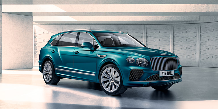 Bentley Dubai Bentley Bentayga Extended Wheelbase Azure SUV front three quarter in Topaz blue paint colour with a grey background