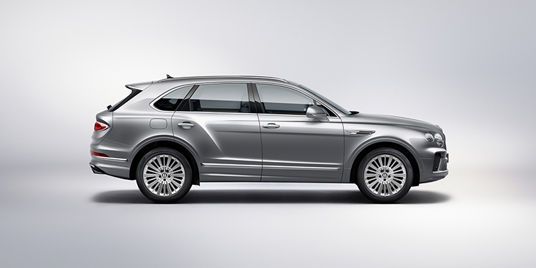 Bentley Dubai Bentley Bentayga SUV side profile in Moonbeam silver paint against white background featuring 21 inch 5 spoke wheels