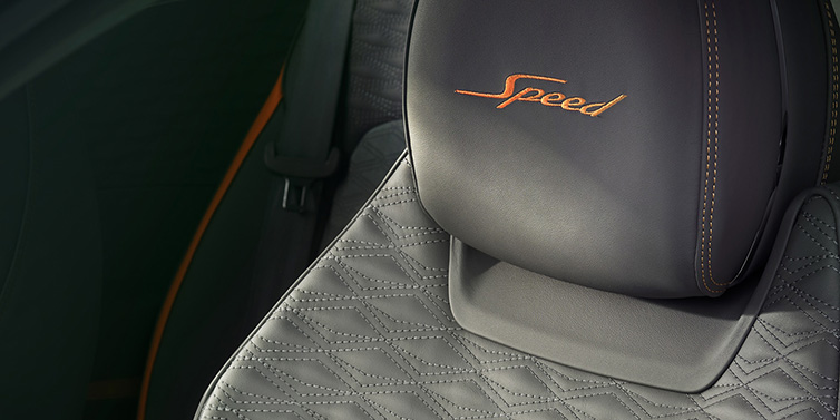 Bentley Dubai Bentley Continental GT Speed coupe seat detail in Gravity Grey hide and Speed emblem in Mandarin by Mulliner coloured embroidery