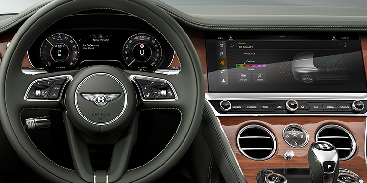 Bentley Dubai New Bentley Continental GTC convertible front interior steering wheel view, with Beluga black leather and Crown Cut walnut veneer